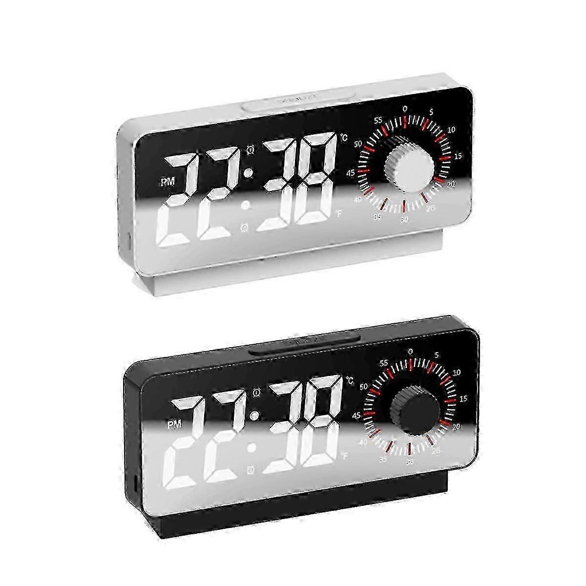 Digital electronic alarm clock with visual timer, mirror thermometer and snooze function.