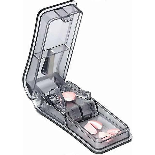 Pill splitter with blade and storage compartment