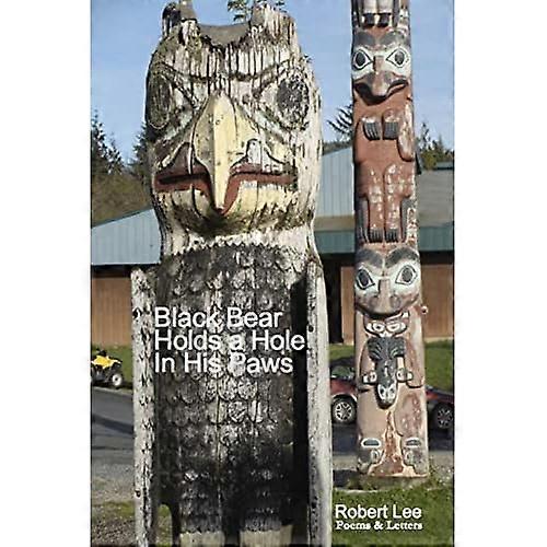 Black Bear Holds a Hole in His Paws