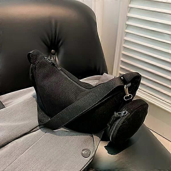 Minimalist crescent handbag with a mini hanging bag for easy storage of items