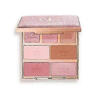 Palette de 7 fards à paupières avec miroir et pinceau pour un regard charbonneux, hautement pigmentée et waterproof pour une tenue longue durée.