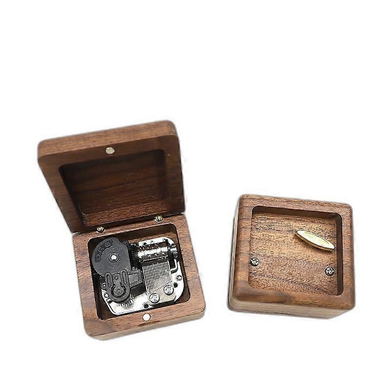 Compact Wooden Music Box with Rounded Walnut Shell and Mechanical Interior