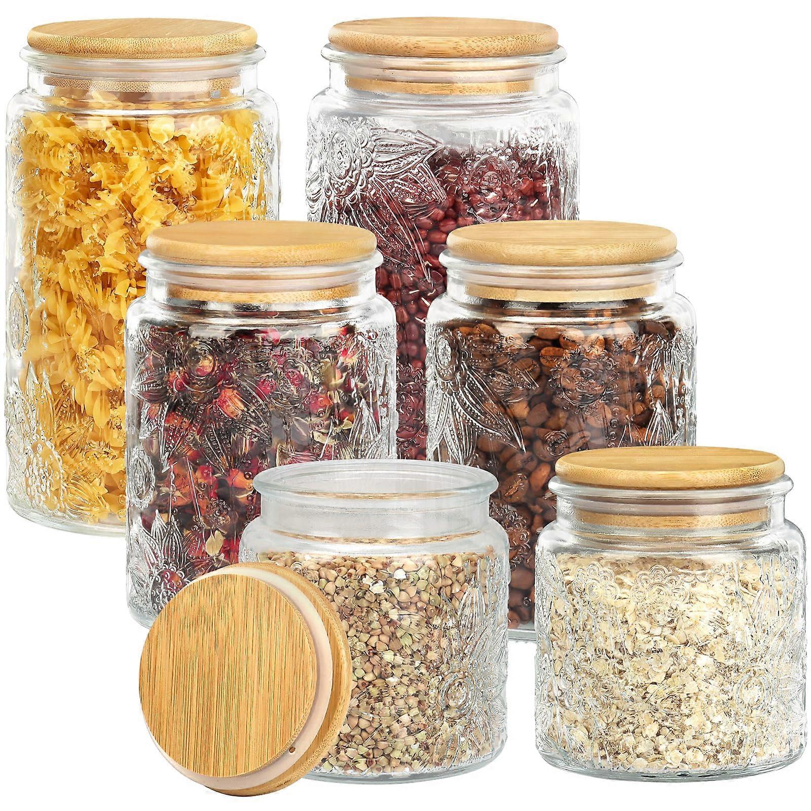 Set of 6 vintage glass storage jars that can be stacked on the countertop