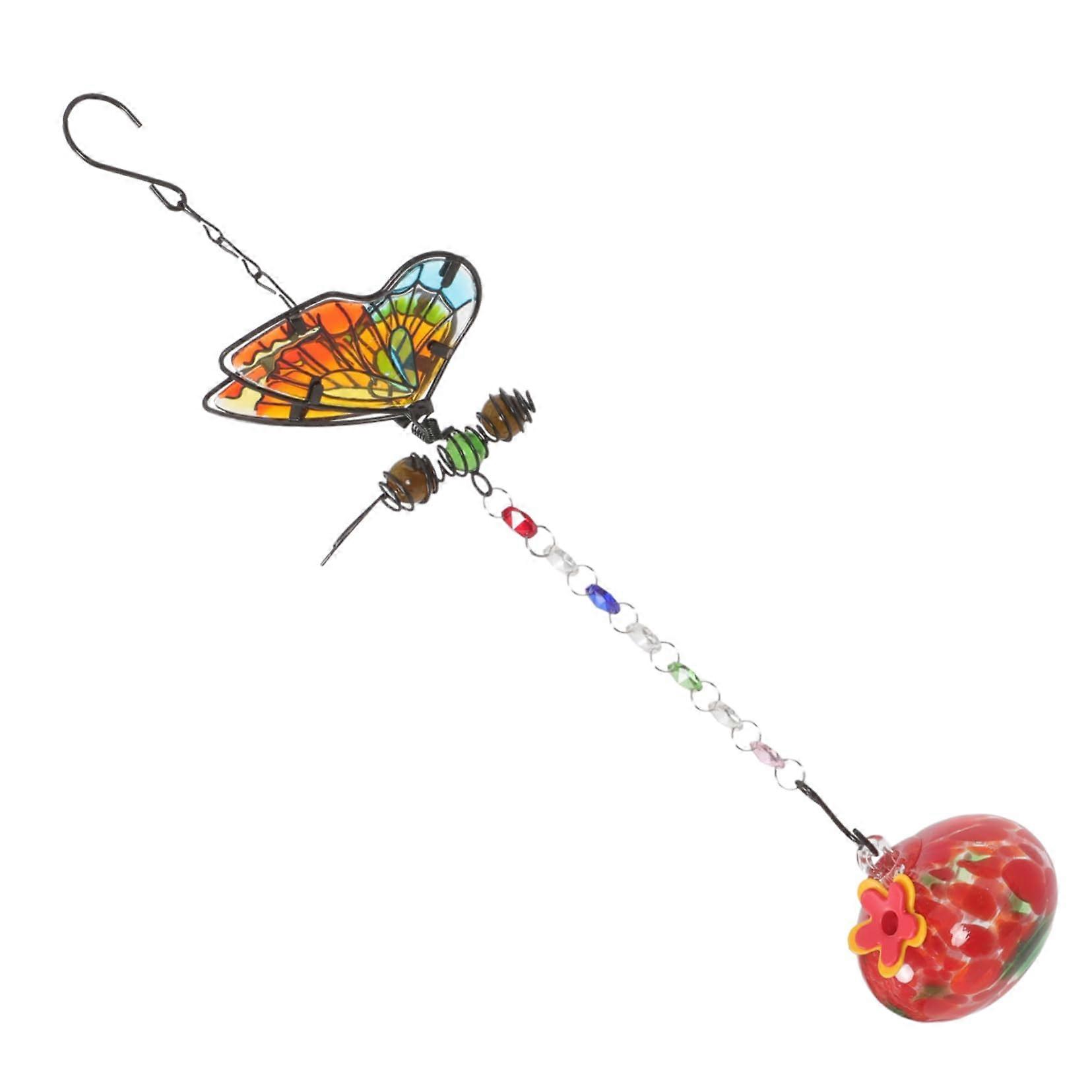 Hanging feeder with decorative bird bath for garden made of durable material featuring geometric glass globe for bird watching outdoors.