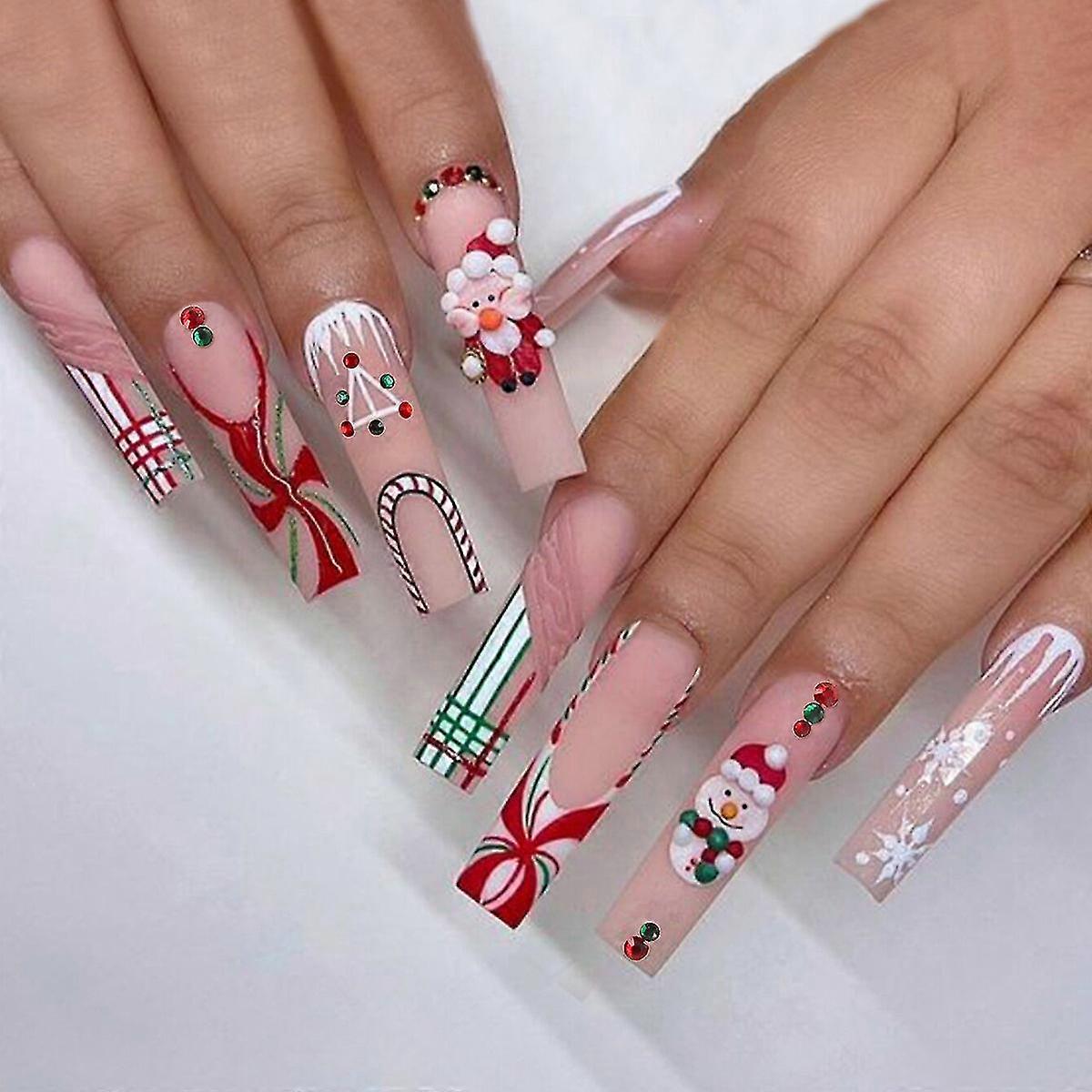Faux ongles flocon de neige Père Noël portant une armure