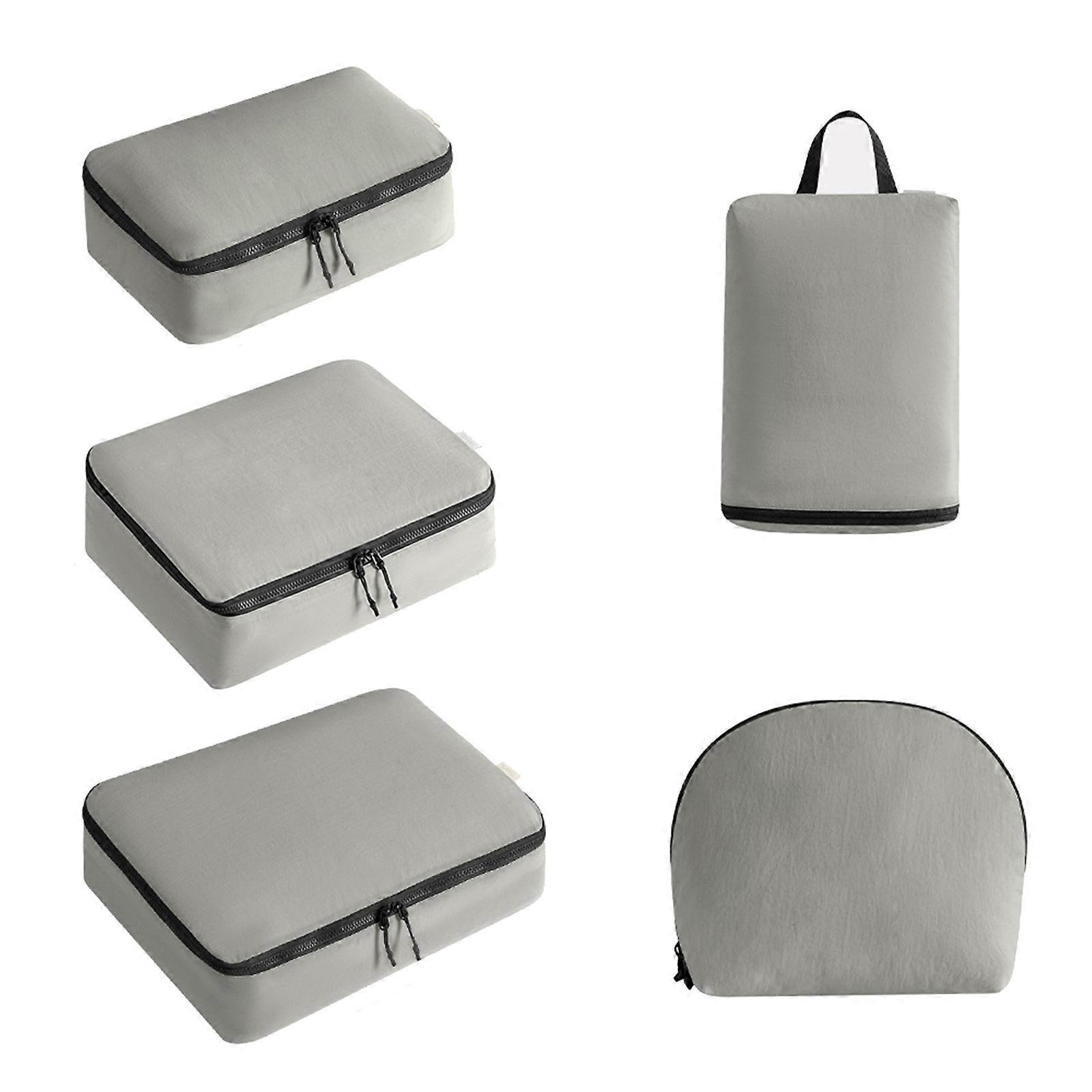 Organisateurs de bagages résistants à l'eau pour longs voyages. Design compact. Sacs de rangement pour vêtements, gain de place dans les valises. Gris.