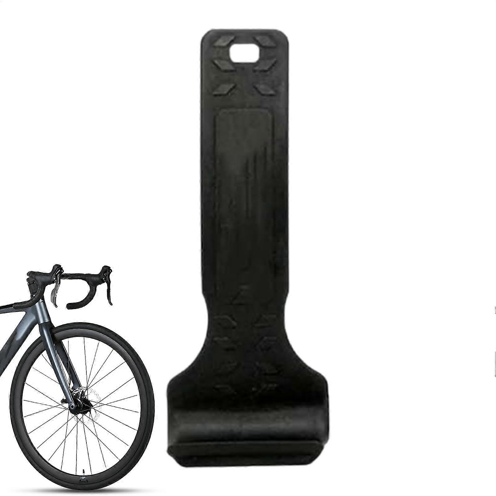Bicycle tire lever, compact multifunctional tool for road and mountain bikes, black.