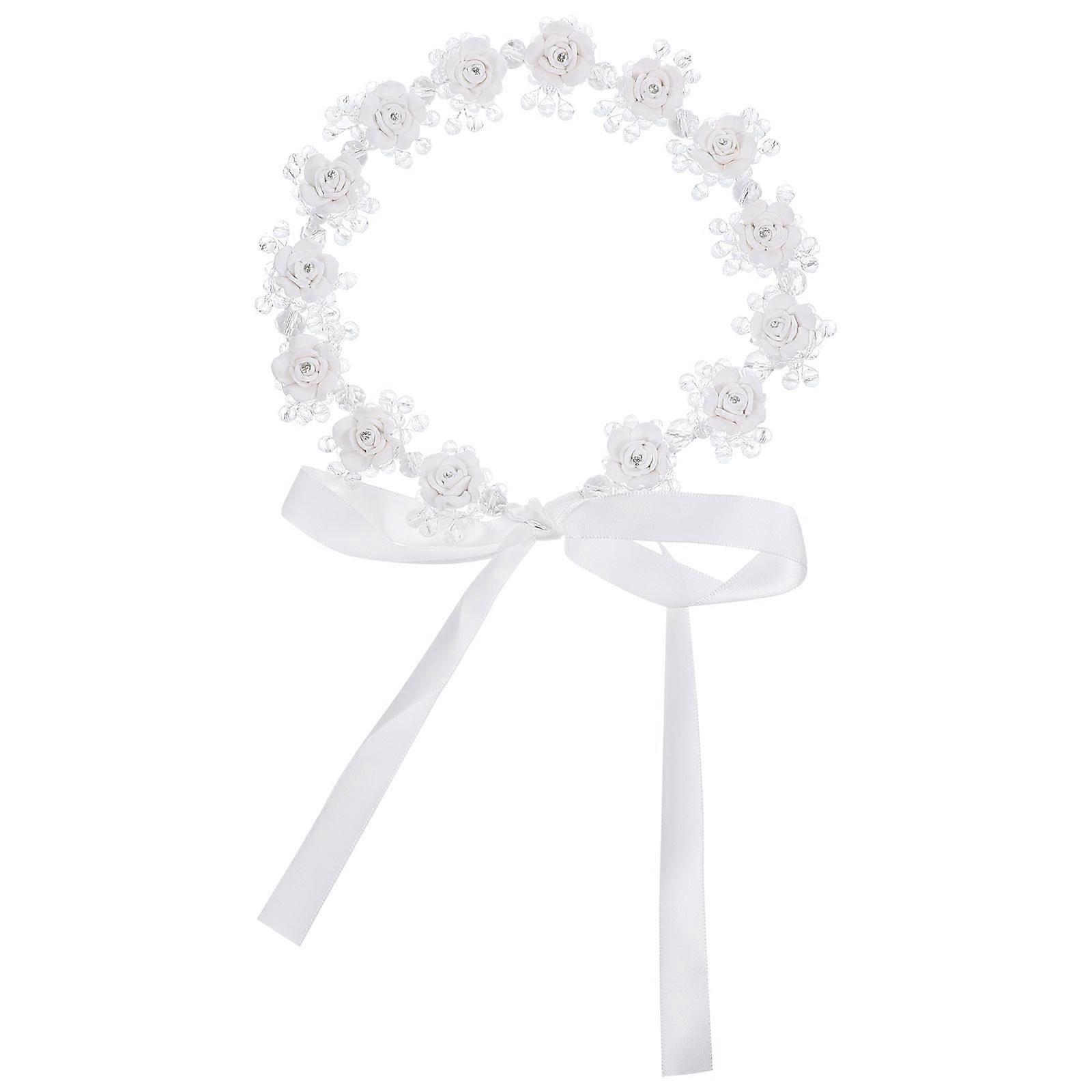 It sounds like you're referring to a **White Crystal Soft Clay Flower Headband**, possibly for a bridal or wedding related event. This type of