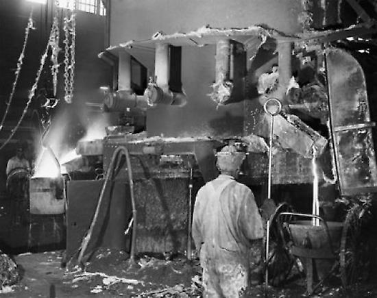 Two foundry workers working in a steel foundry Poster