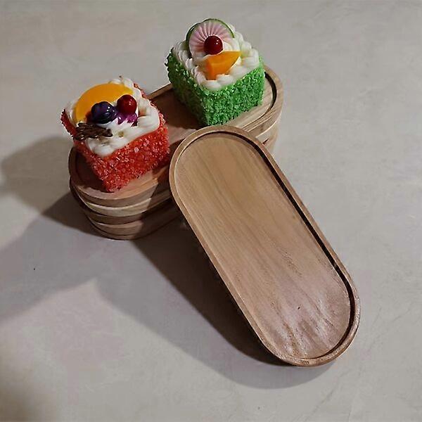 Platos de postre de madera, de forma ovalada, con temática festiva