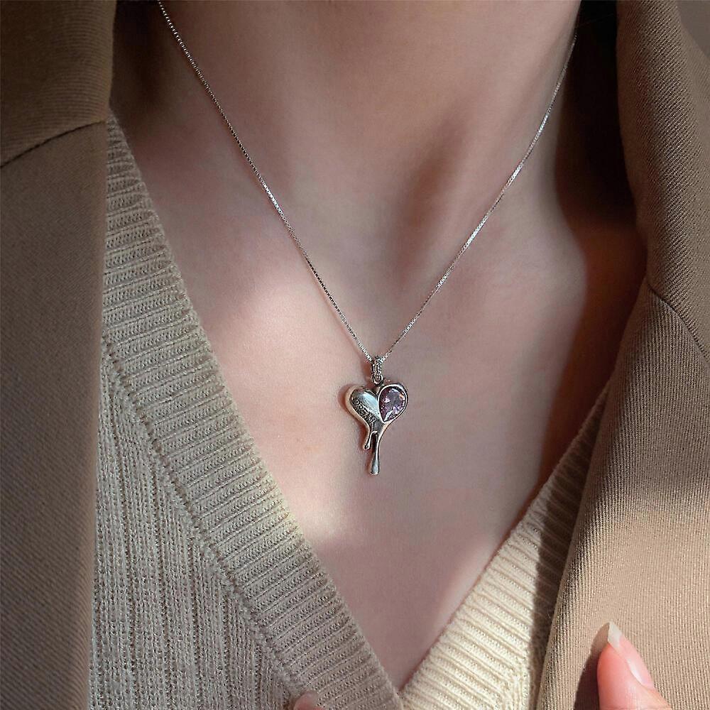 Women's heart-shaped pendant necklace, pink lava design, sparkling and unique, elegant jewelry.