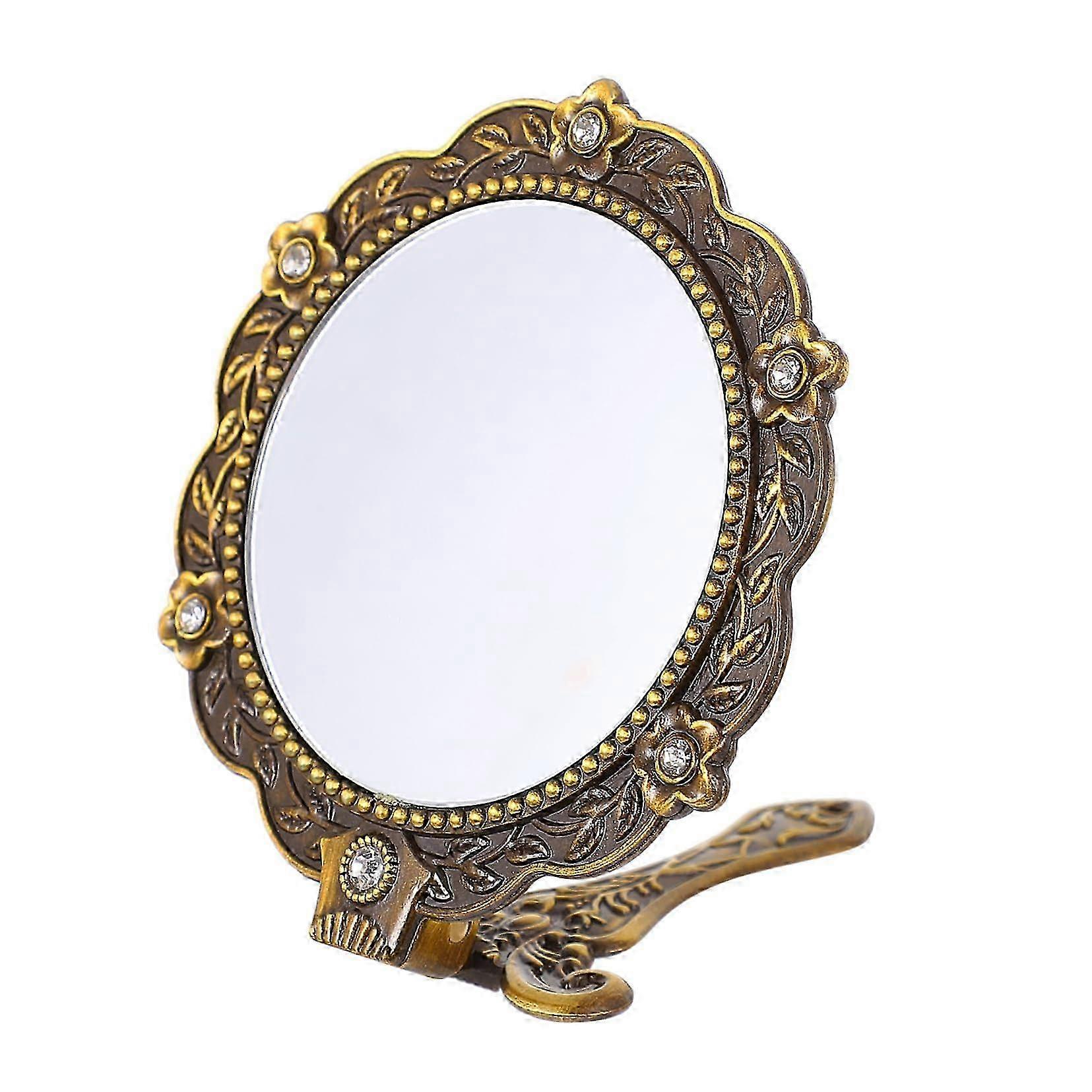 2026 Tiny vintage hand mirror.