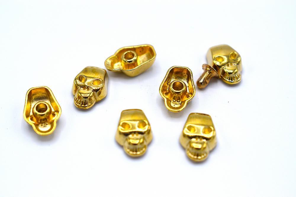 Gold-colored loose rivets skulls - 50 pieces