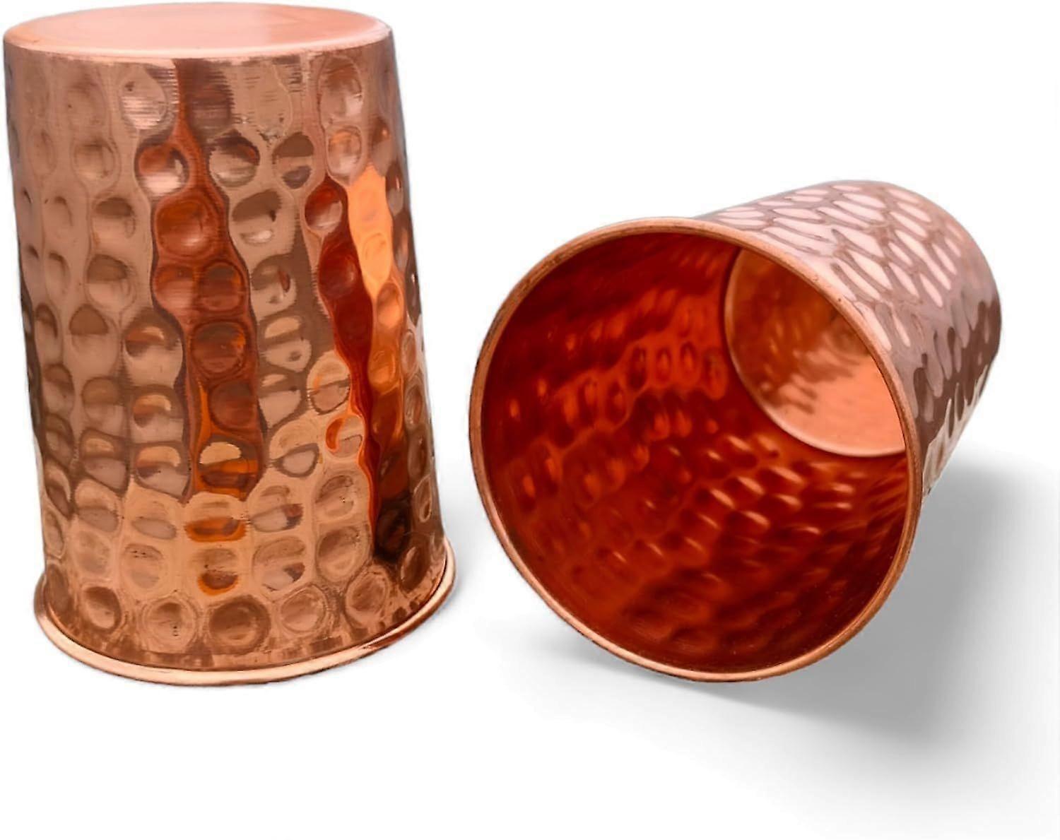 Two hammered pure copper drinking cups, suitable for Ayurvedic therapy.