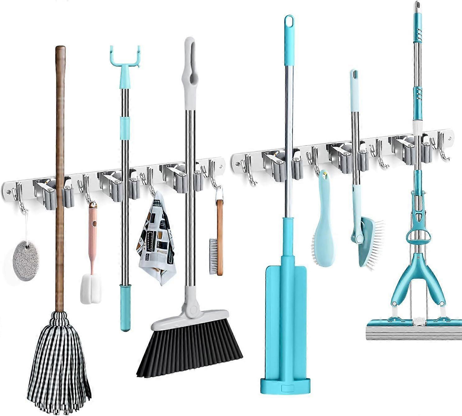 Broom holder wall. 2 stainless steel tool holders.