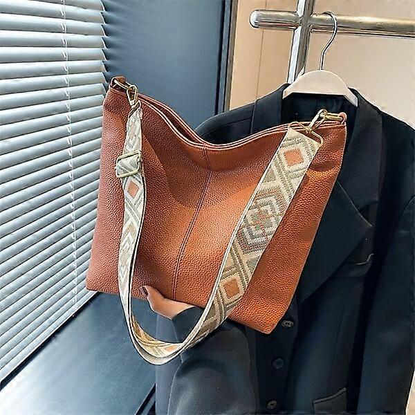 Large-capacity handbag made of PU leather with comfortable shoulder straps and diverse designs