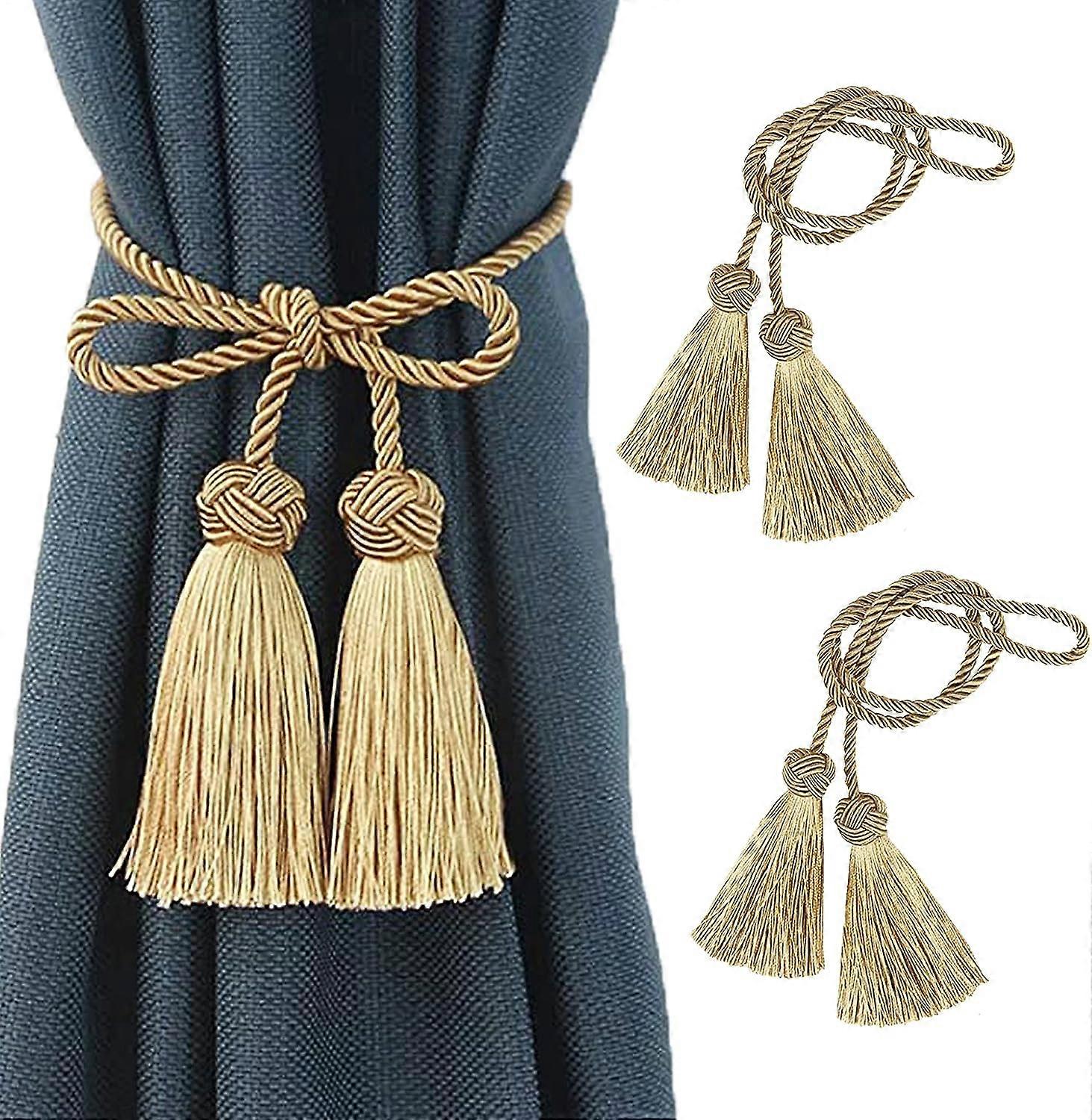 Pair of rope curtain tiebacks with tassels, gold