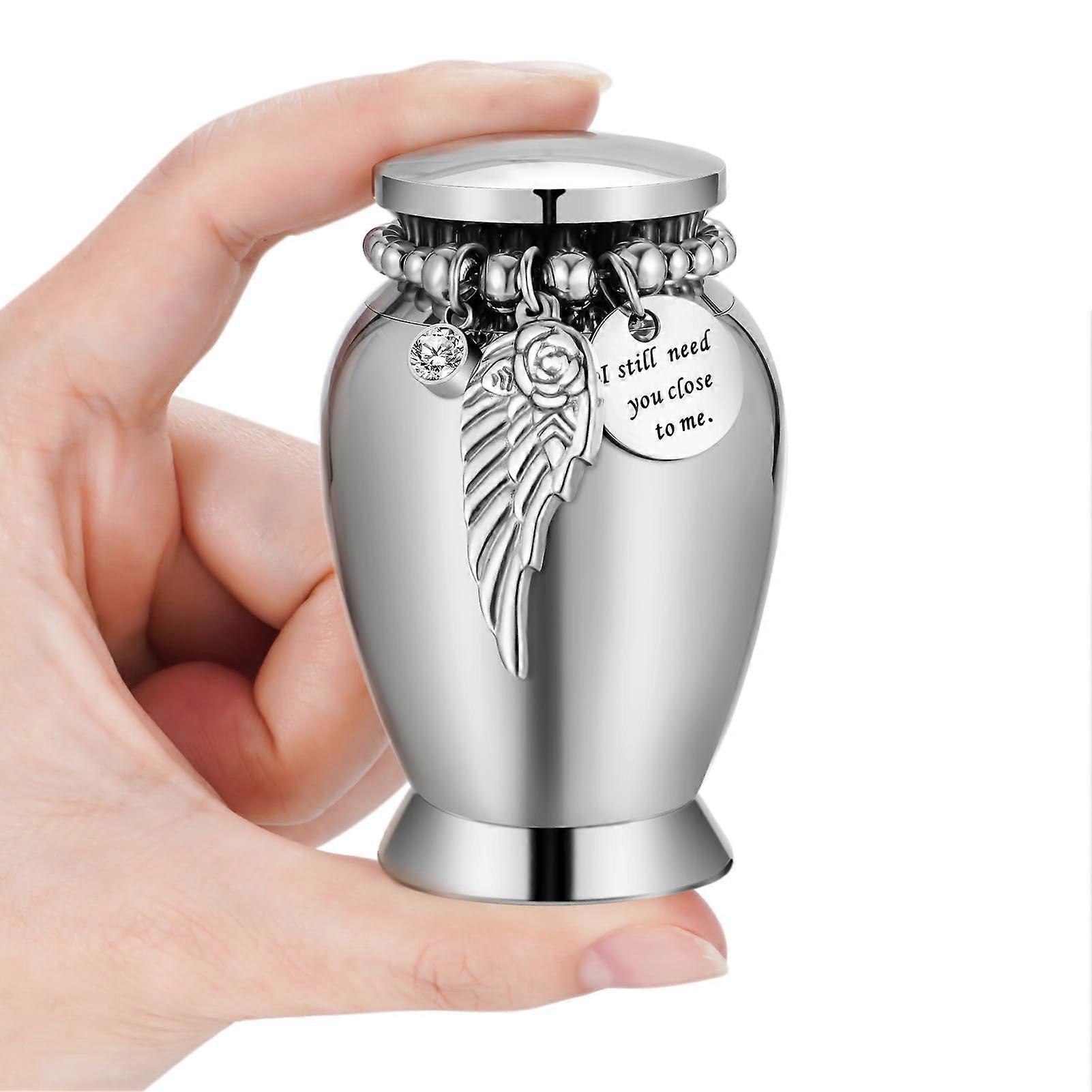 Keepsake Urn for Ashes Small Stainless Steel Memorial Urn with Secure Threaded Lid Wings Design
