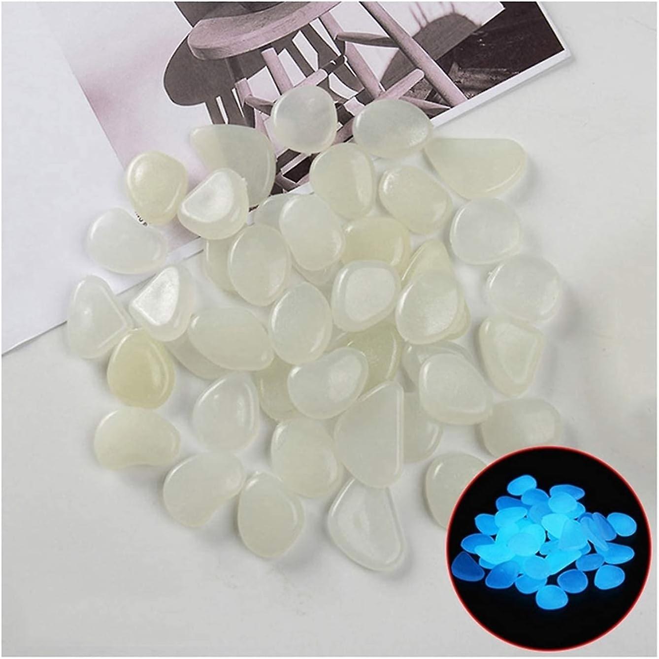 100pcs אבנים זוהרות זוהרות בחלוקי נחל כהים אבנים זוהרות עבור שבילים חיצוניים הום גארדן חצר דגים דקור סלעי חלוקי נחל