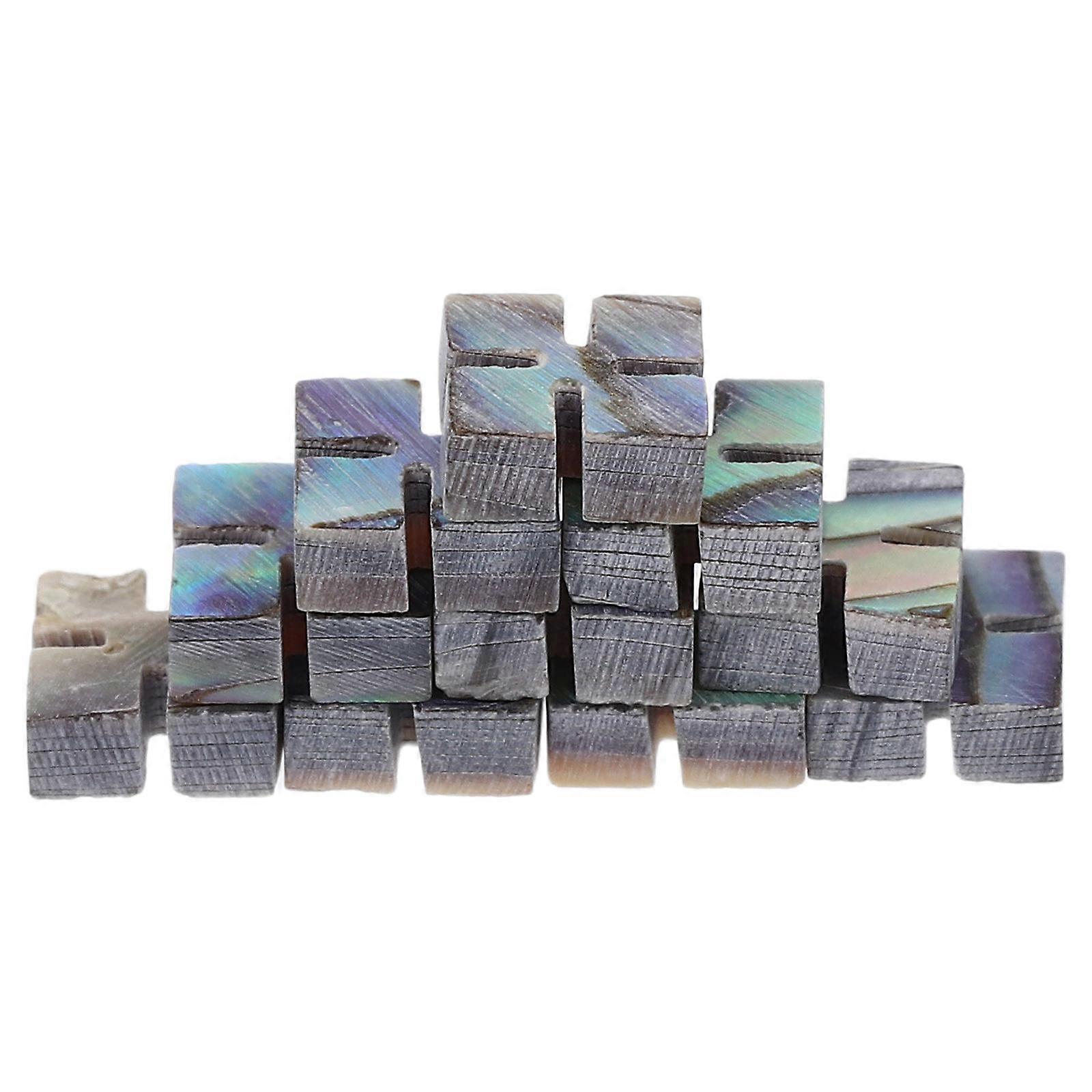 It sounds like you're referring to a product listing or description for **abalone shell inlay dots**, commonly used as decorative elements on
