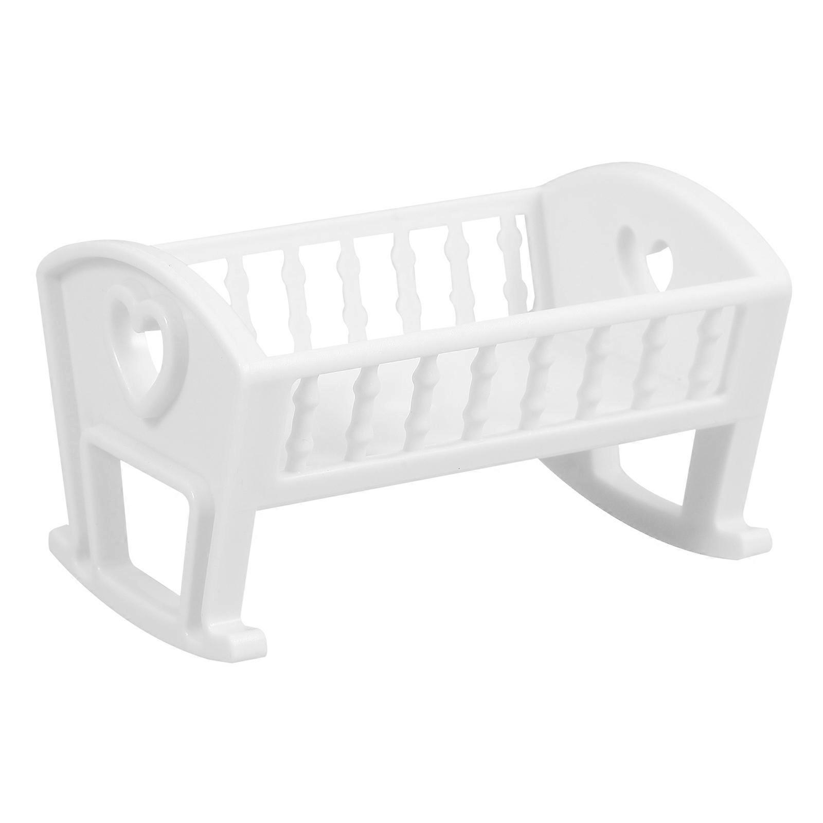 It sounds like you're referring to a **crib dollhouse decoration** — specifically, a **realistic miniature bedroom furniture set** designed for