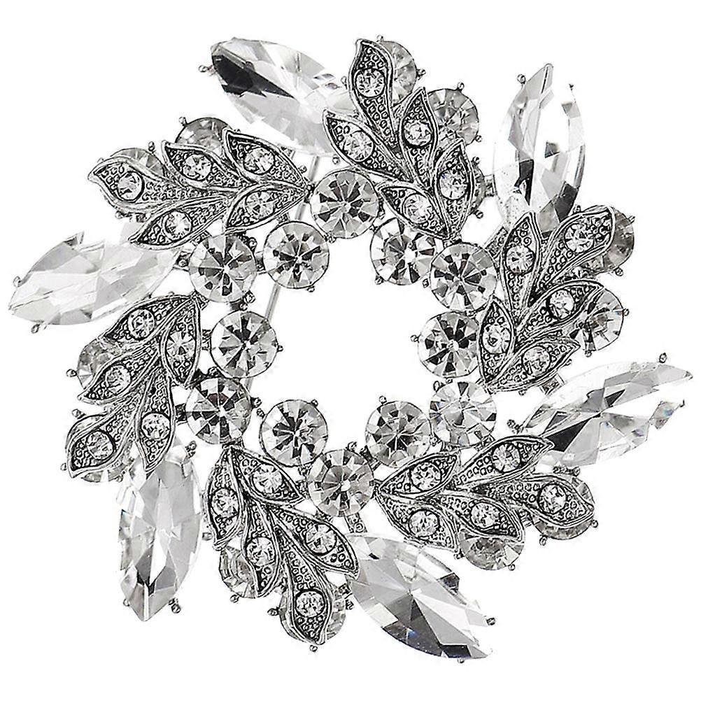 Broche de mariée ornée d'une fleur en strass.