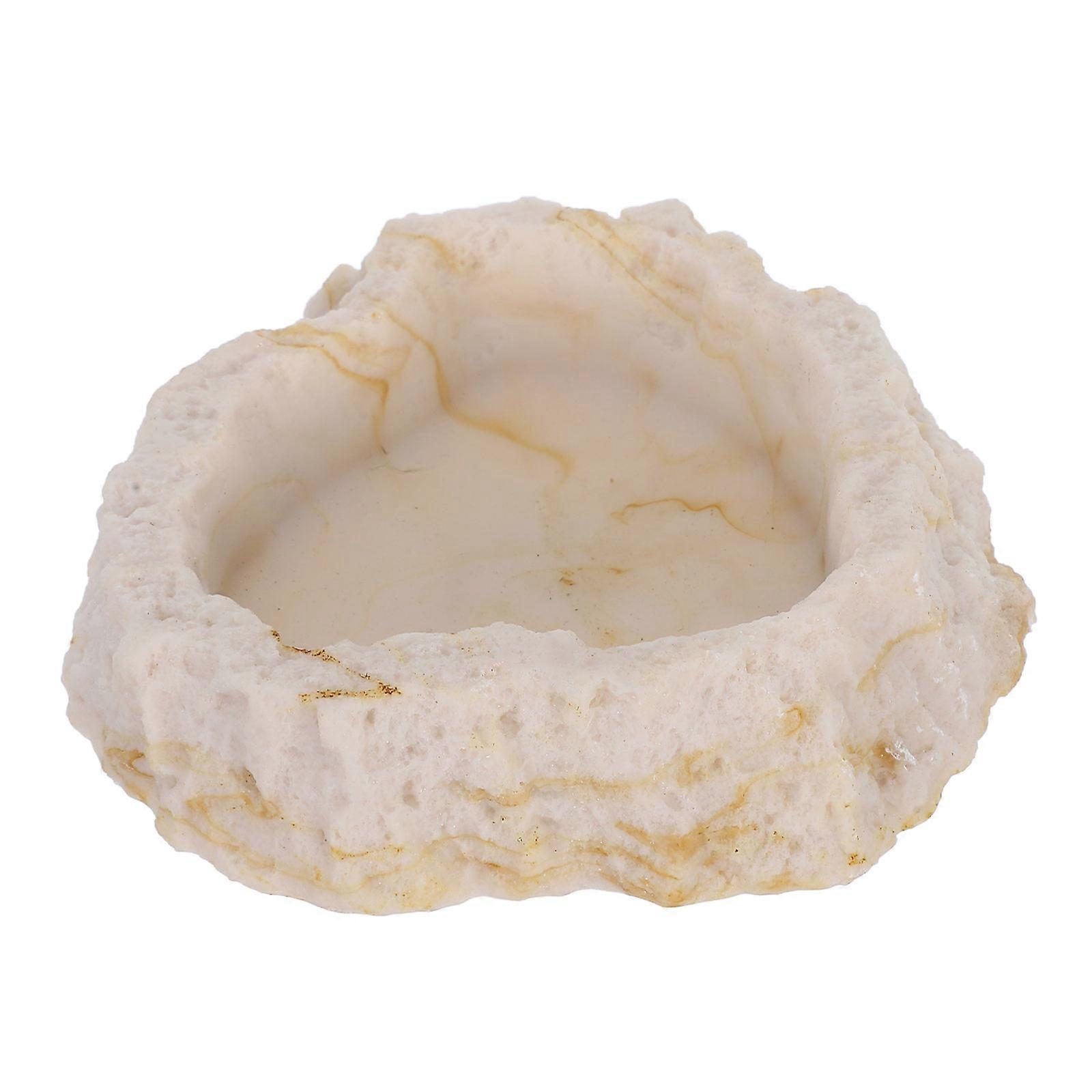 The **Simulation Rock Reptile Feeding Bowl** is a practical and realistic accessory designed for use in reptile enclosures. Here's a detailed