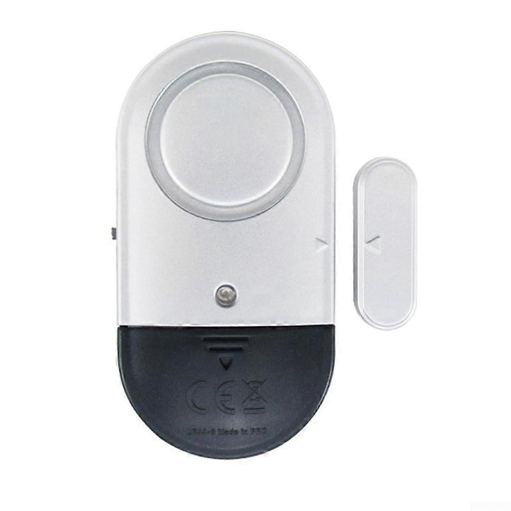 Simplified batterypowered wireless door alarm with intense 130 dB sound