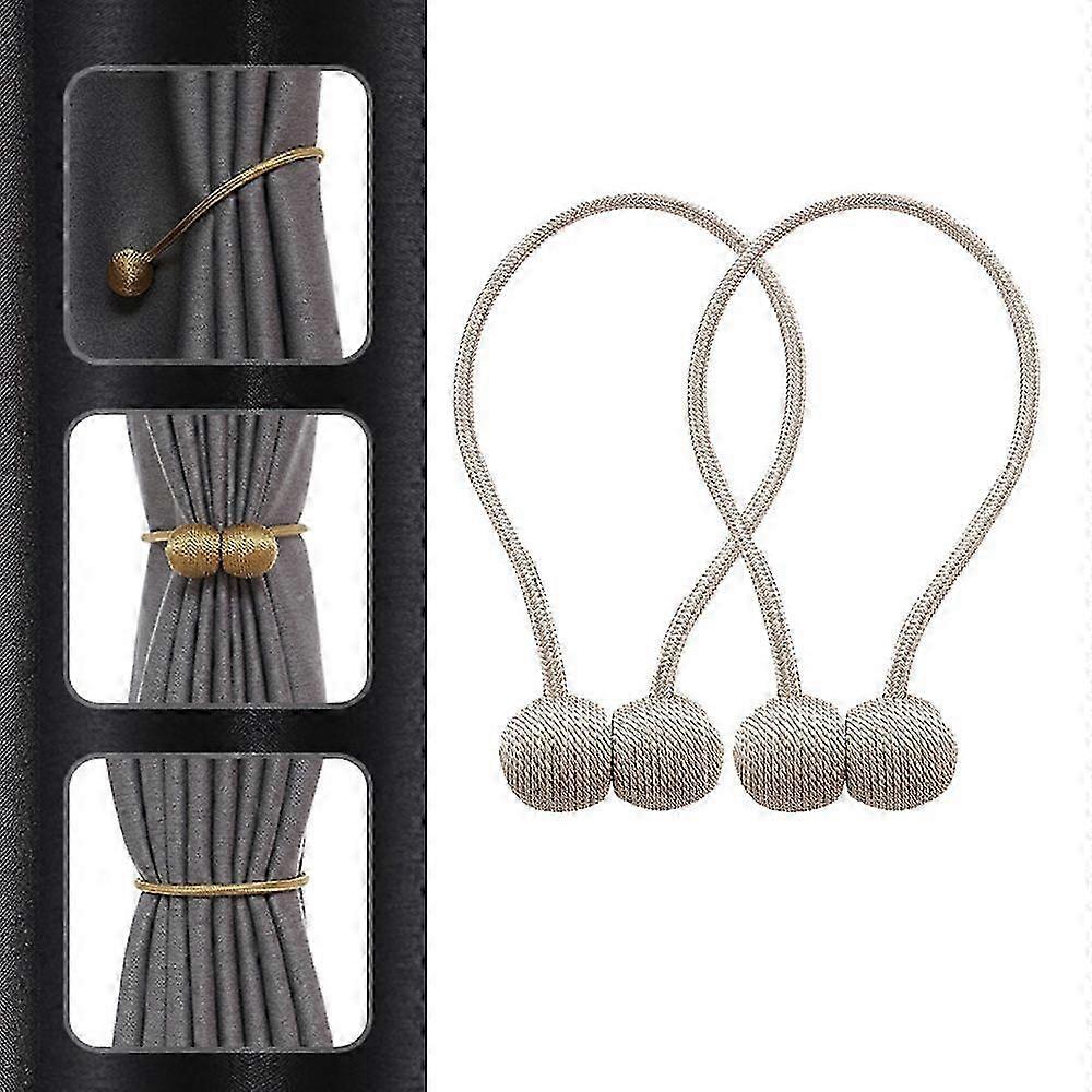 Two beige curtain tiebacks approximately 45 cm in length featuring magnetic curtain tiebacks and buckle design