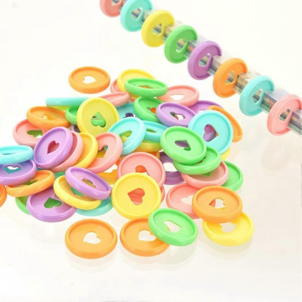 24MM. 100 plastic rounds (random color), multi-colored binding rounds, for adding extra pages, notes or illustrations.