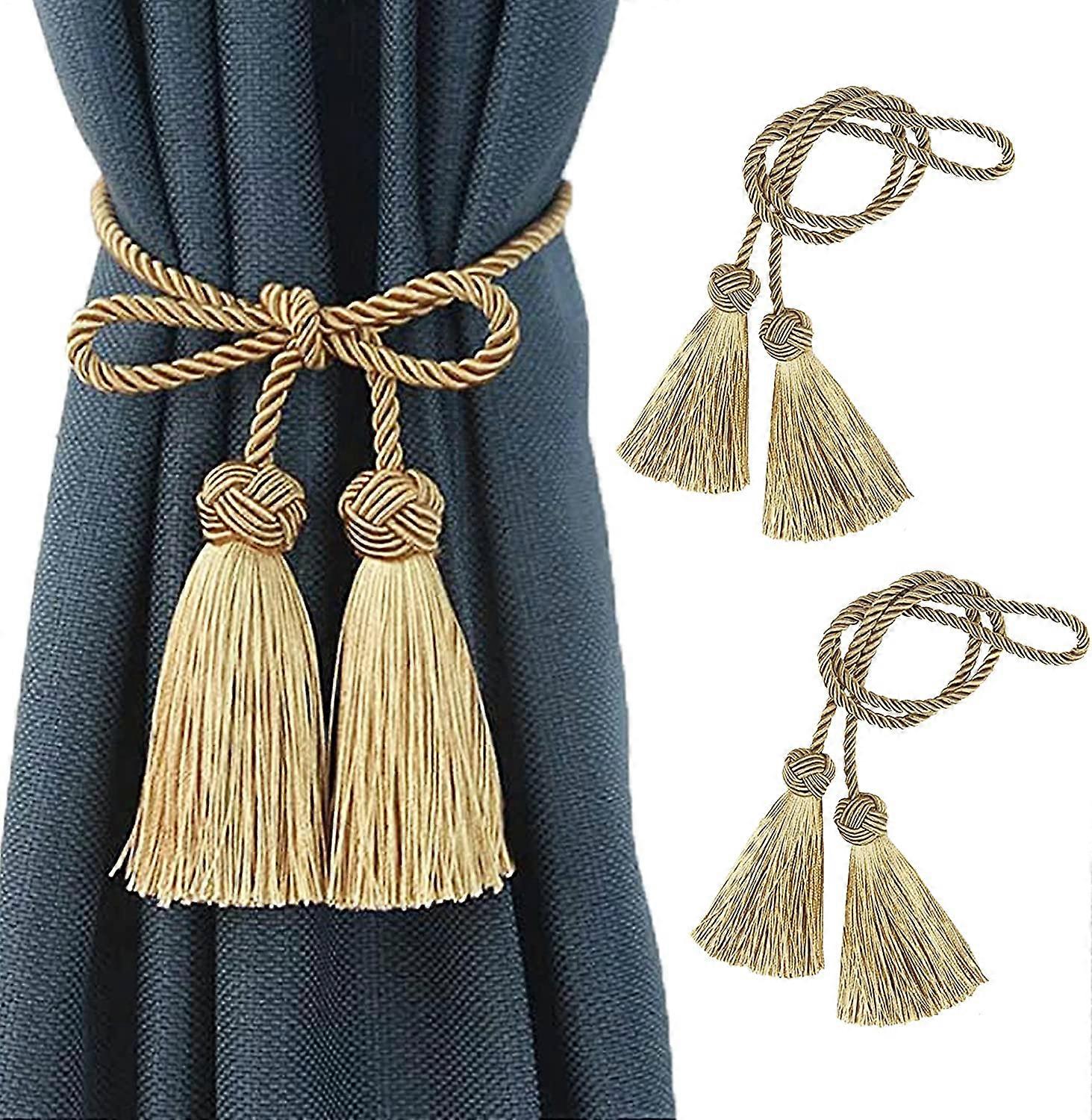 Pair of rope curtain tiebacks with tassels, gold