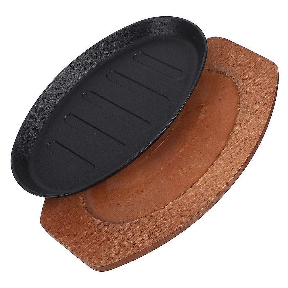 It looks like you're describing a product listing or title for a **cast iron sizzling steak platter with a wooden base**, ideal for indoor cooking