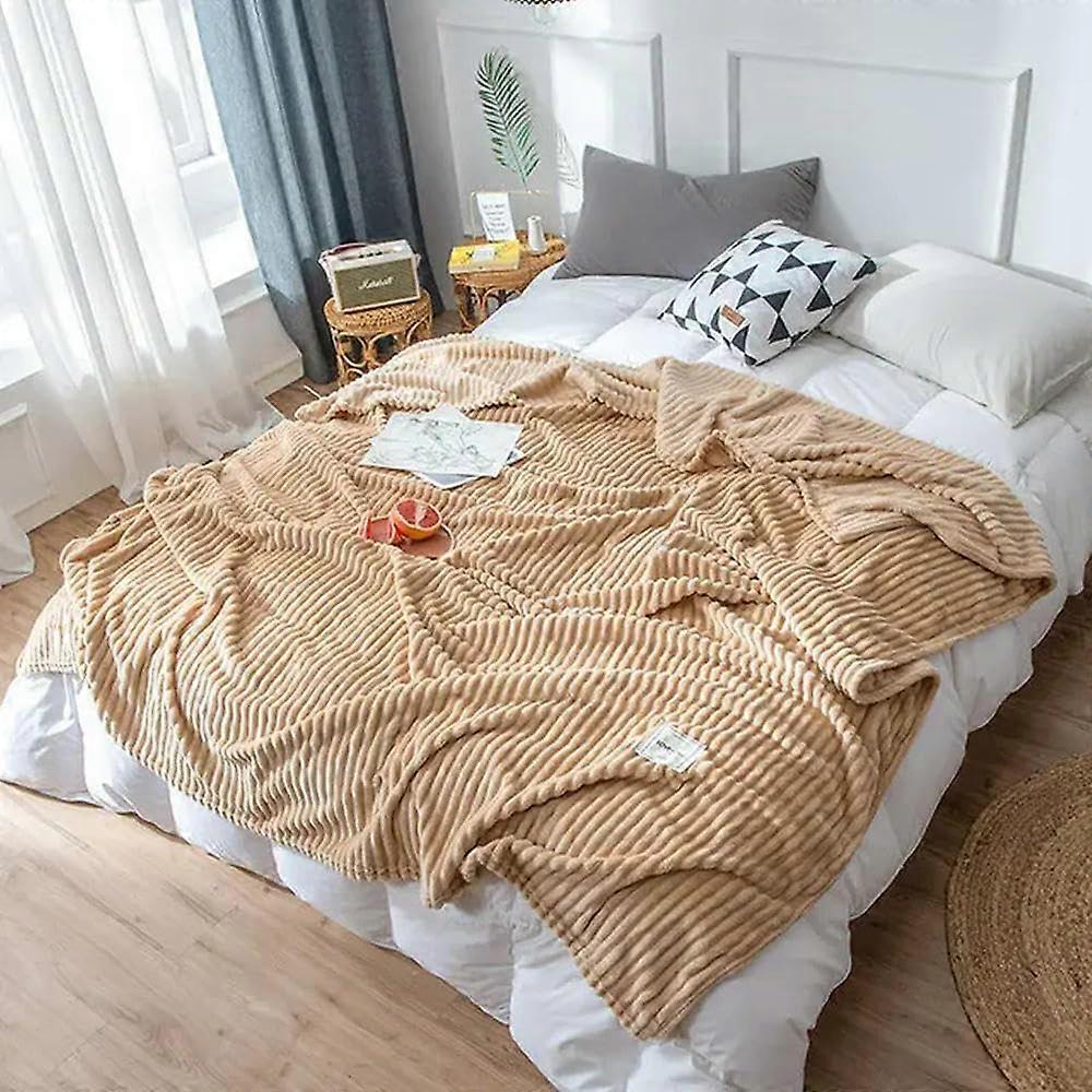 The cozy patterned blanket is suitable for sofas, beds, as a throw in camel color. 200x230cm.