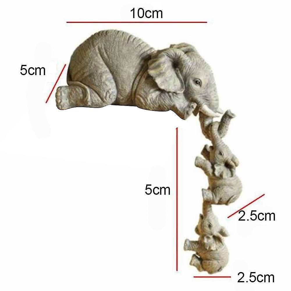 Elephant Mother Hanging Two Baby Figurines Hanging On The Edge Of A Shelf Or Table