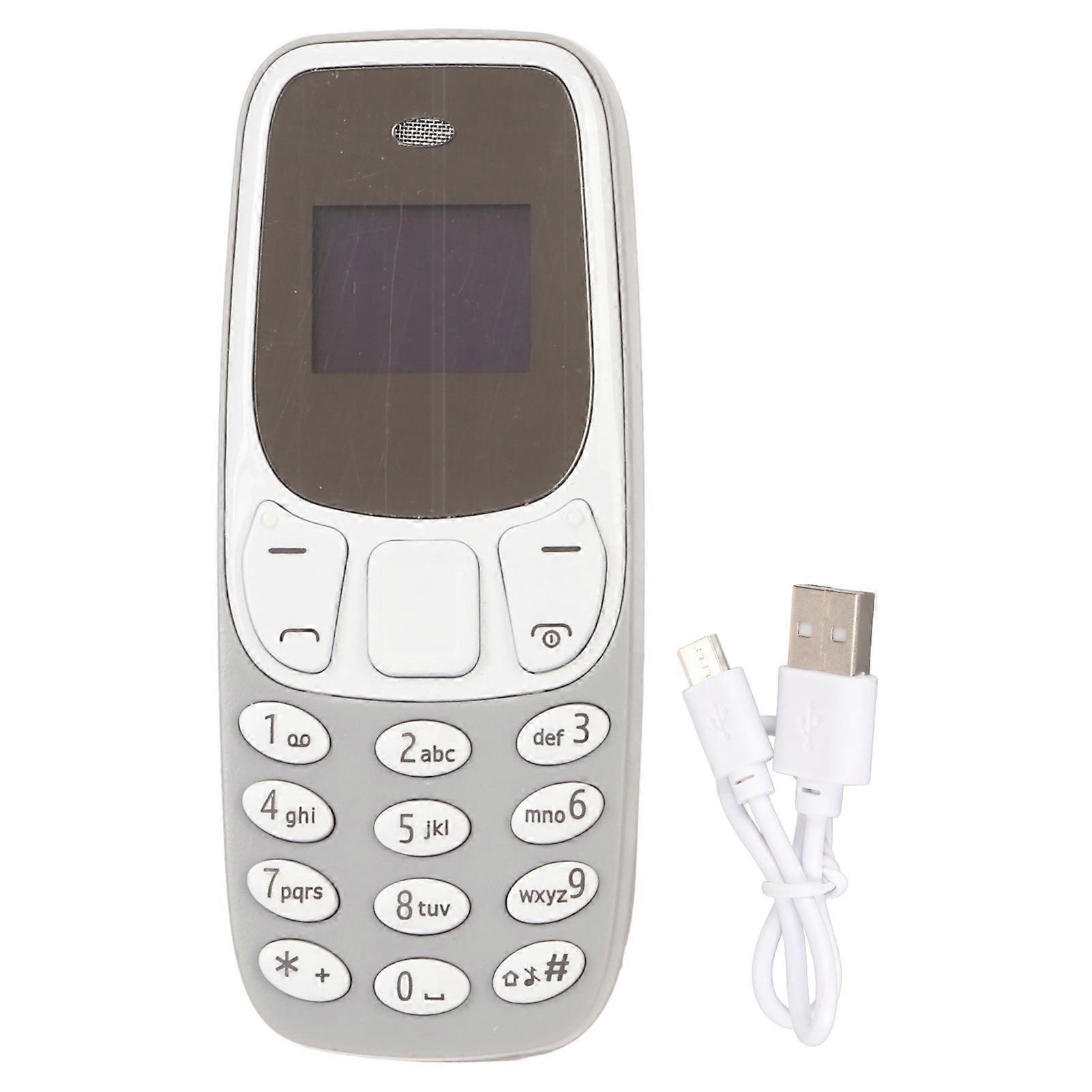 世界最小の携帯電話、ハンズフリーBluetoothダイヤラー、デュアルSIMカードロック解除GSM 2 in 1ミニ携帯電話、グレー