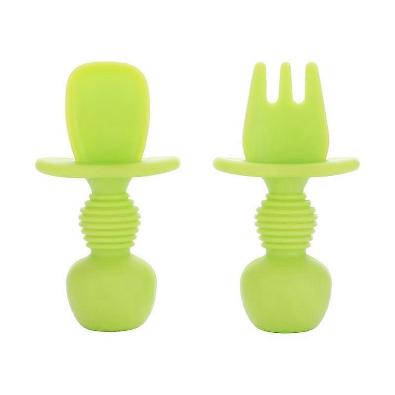 Ergonomic learning cutlery facilitating self-feeding - green