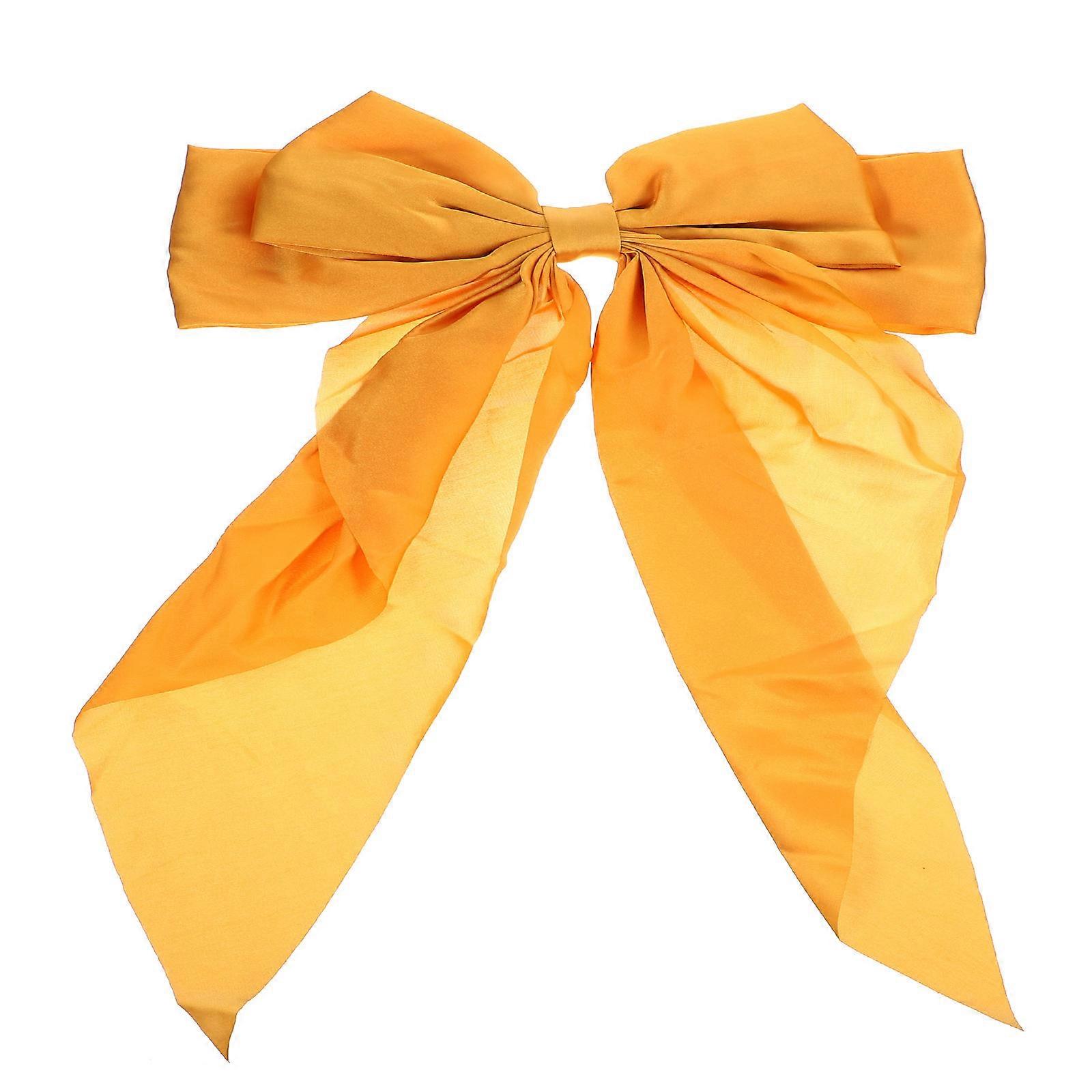 The **Big Bow Hair Clip with Long Satin Ribbon** is a versatile and elegant accessory that adds a touch of sophistication to any hairstyle. Whether