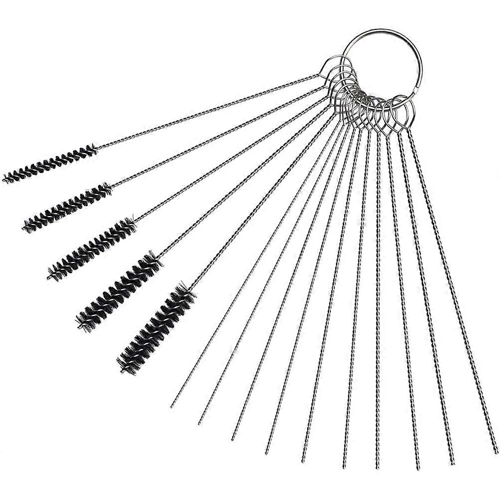 Cleaning needles for carburetor dirt with brush kit