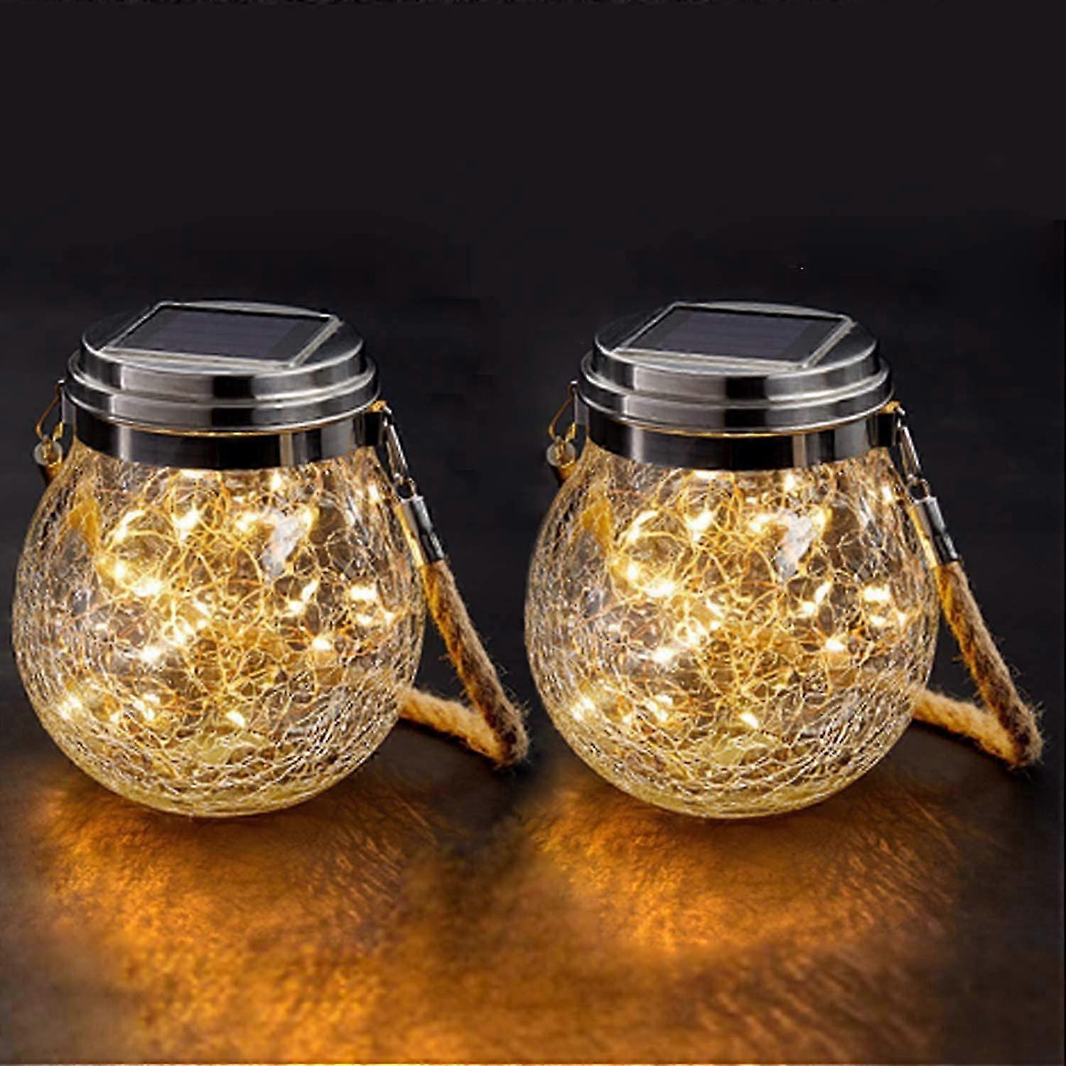 Solar lamp, 2 - pack, with crackle glass design, built - in string lights, metal top and rope handle, perfect for outdoor decoration