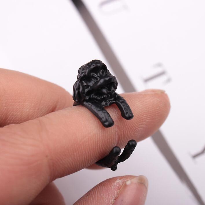Ring with dog hugging finger poodle black 