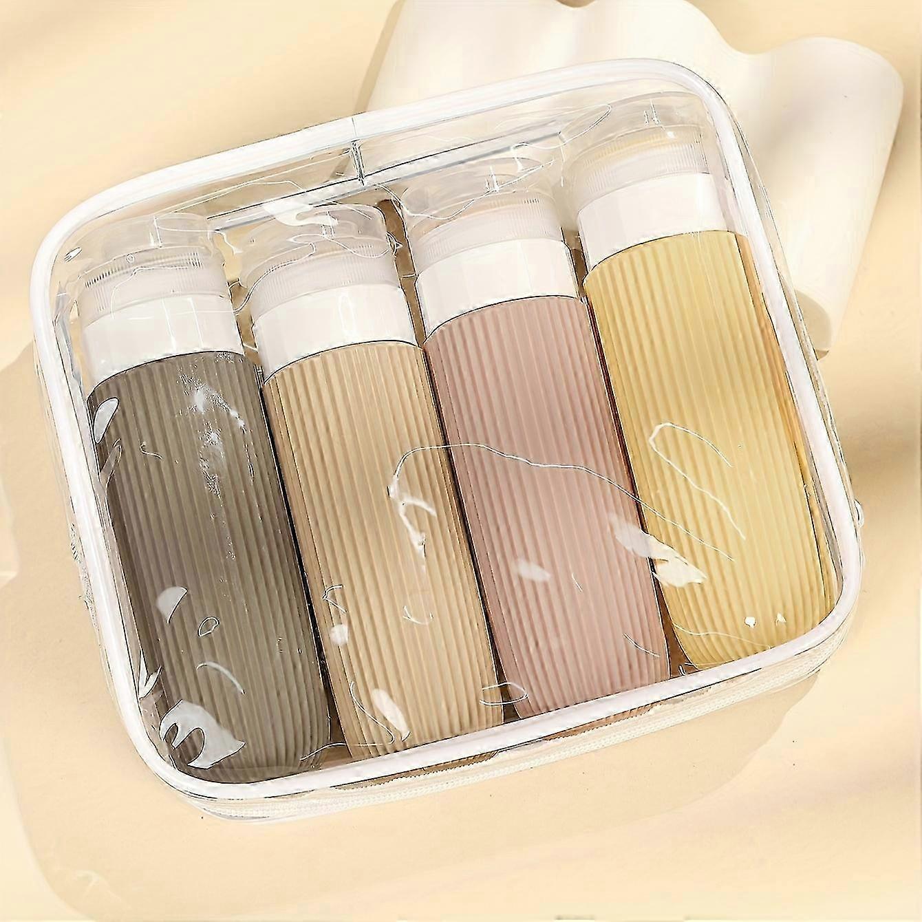 Set di 4 bottiglie da viaggio approvate dalla TSA - Contenitori in silicone resistenti, a prova di perdite e con chiusura di sicurezza - Senza BPA, design facile da spremere - Include bottiglie trasparenti di alta qualità