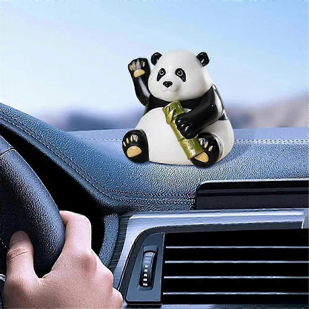 Solar-powered panda bear bobblehead figurine that dances in typical British garden sunlight