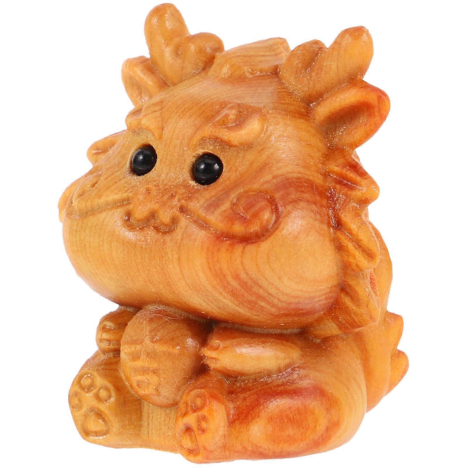 It looks like you're describing a product listing for a **tiny wooden carved dragon charm**—possibly for like Etsy, , or a craft store. Here's a