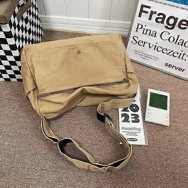 Large canvas shoulder bag for men with side pocket design, comfortable to carry