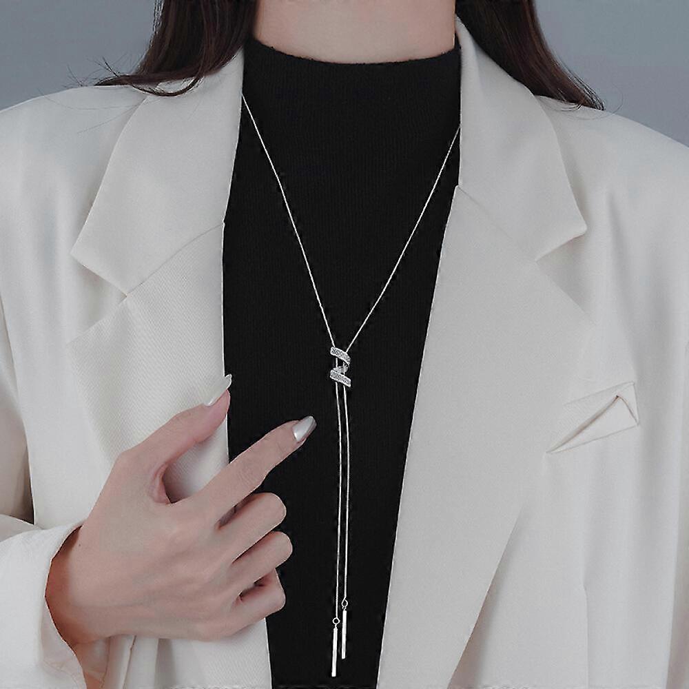 A silver necklace with a simple pendant; its understated design makes it a versatile women's accessory.