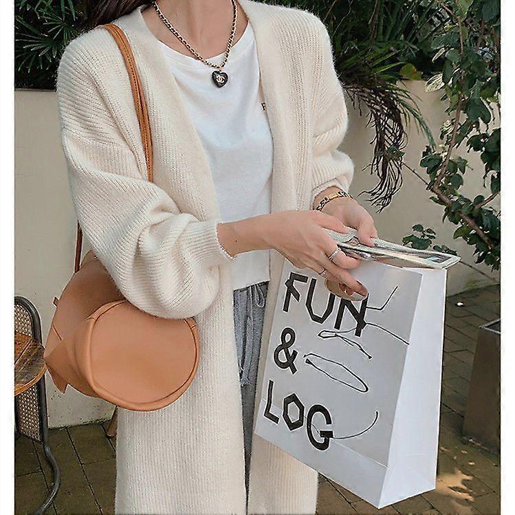 A Soft And Plain-Colored Knitted Cardigan For Women In A Loose And Laid-Back Spring Style, Featuring A Long Sweater Coat