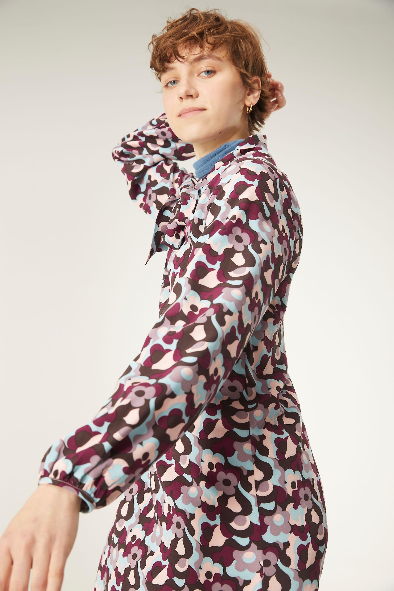 Short flared dress with tie neck and psychedelic floral print by Compania Fantastica