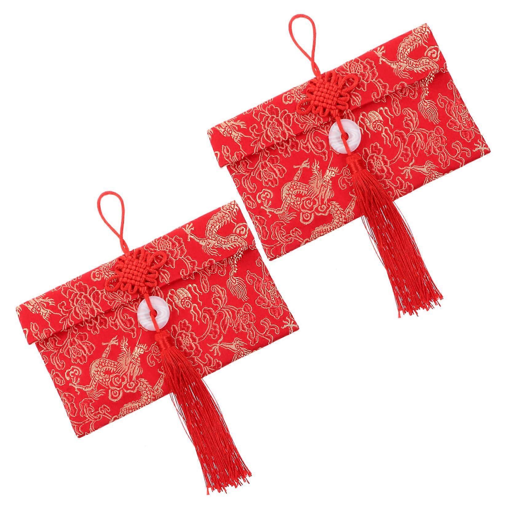Beautiful red envelopes with gold embossing, red packages for special occasions during Chinese Year.