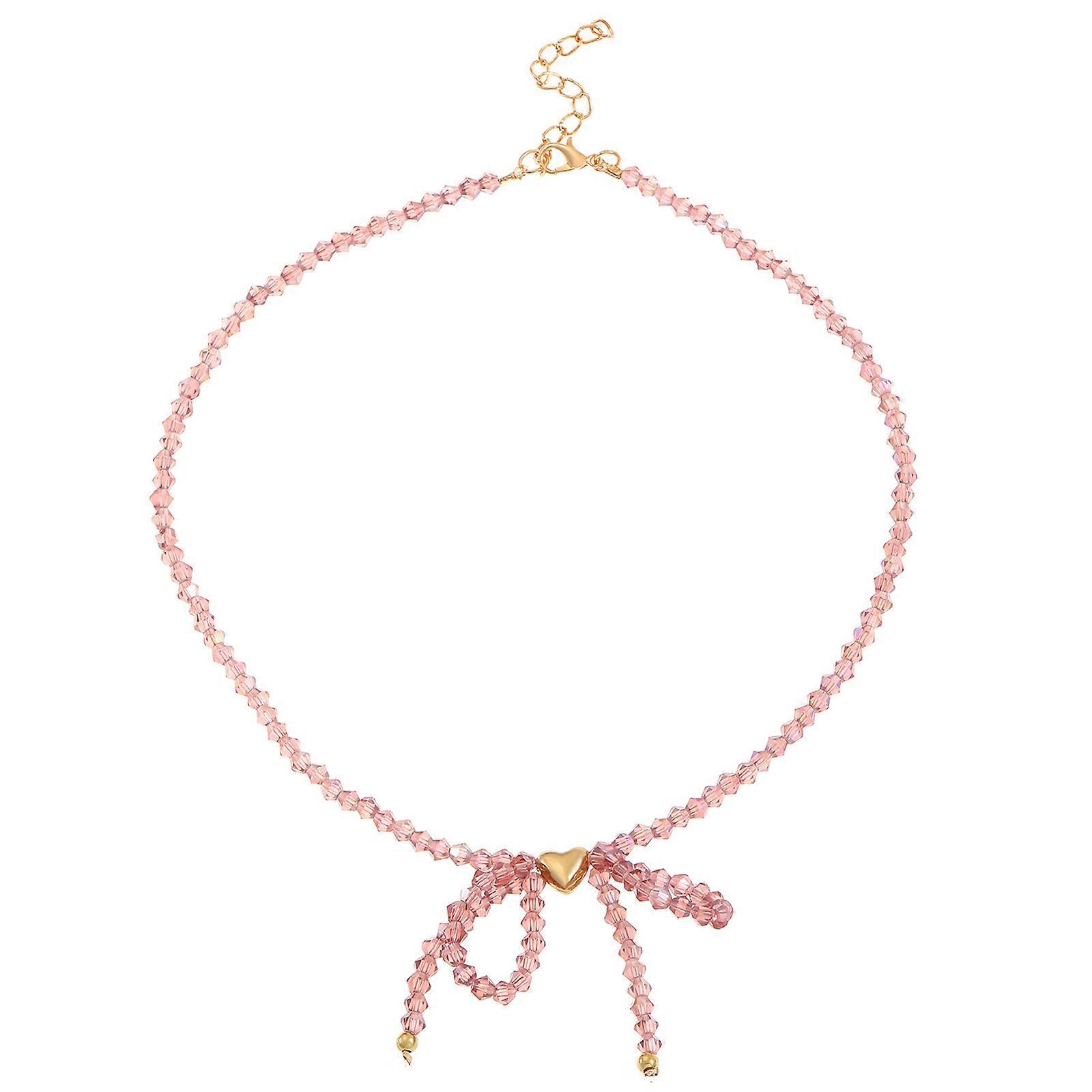 Collier élégant avec pendentif en cristal et nœud papillon, idéal pour les passionnés de mode, pour un usage quotidien ou décontracté.