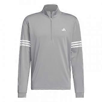 Chaqueta deportiva Adidas para hombre con cremallera de un cuarto y tres rayas.